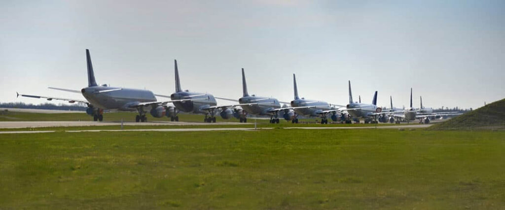 Multiple airplanes driving down a runway